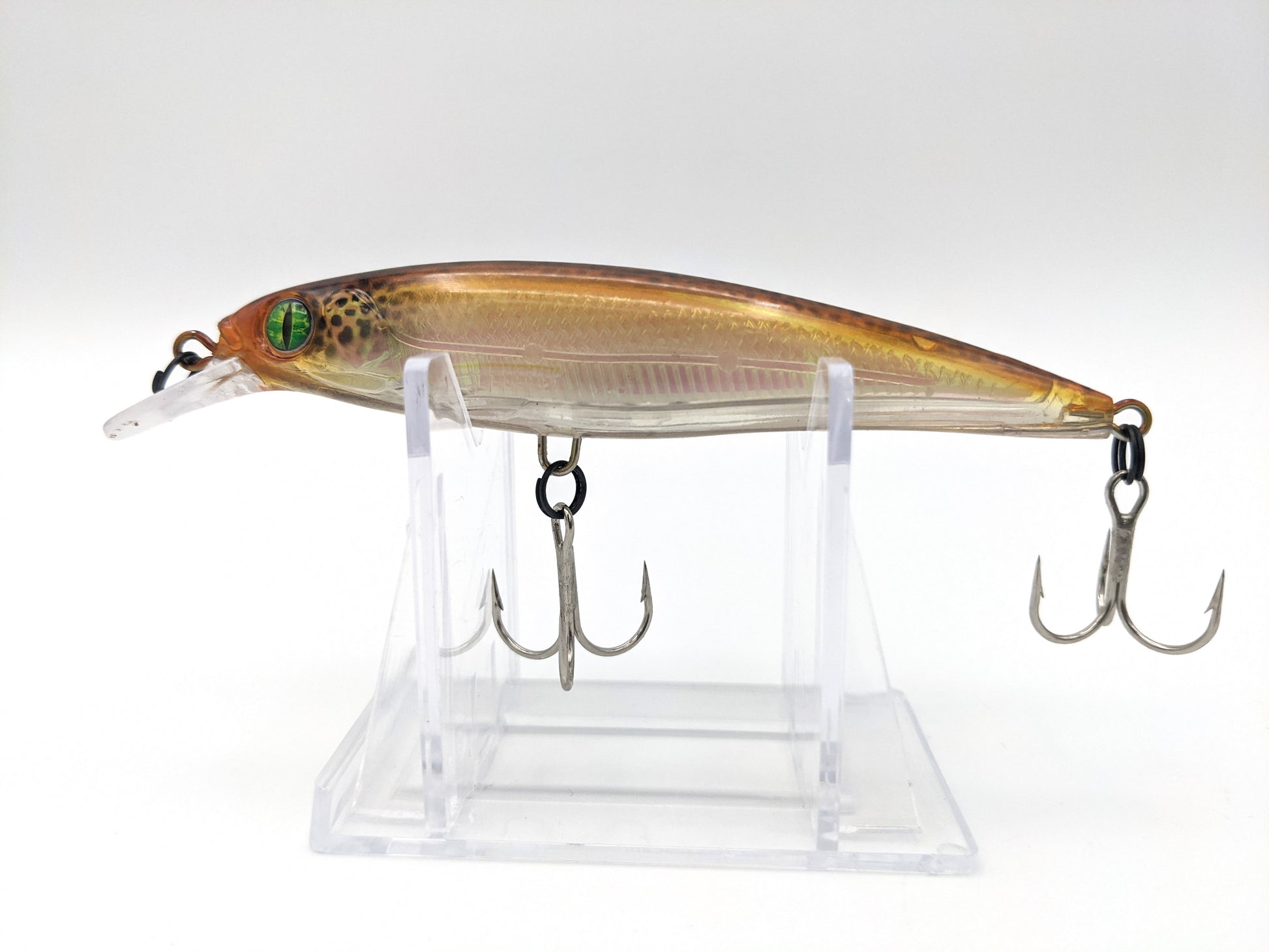 A fishing lure turned on the lathe from maple. Airbrushed, weighted,  rattles added and coated with clear epoxy.